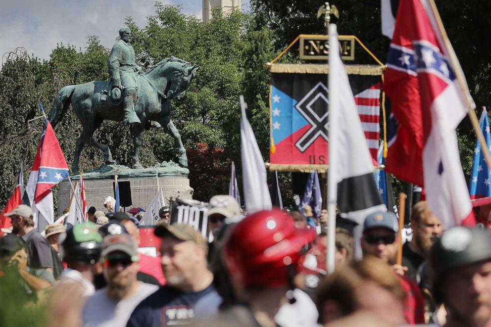 PHOTO: The statue of Confederate General Robert E. Lee stands behind a crowd during the "Unite the Right" rally Aug. 12, 2017 in Charlottesville, Va.