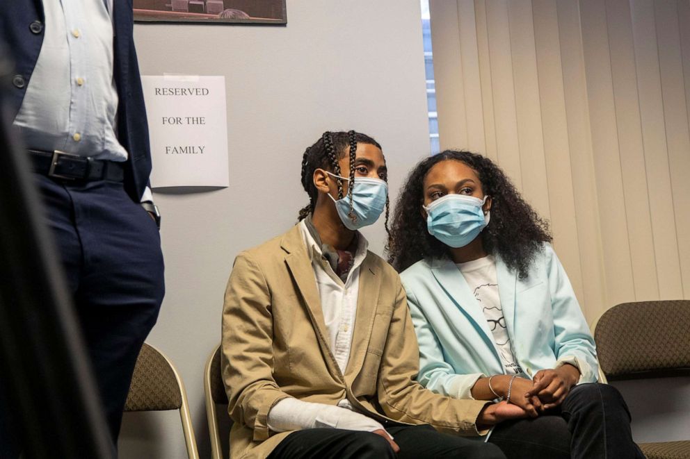 PHOTO: Taniyah Pilgrim, right, and Messiah Young hold hands as they listen to Fulton County District Attorney Paul Howard speak on their behalf during a press conference by the Fulton County District Attorney's Office in Atlanta, June 2, 2020.