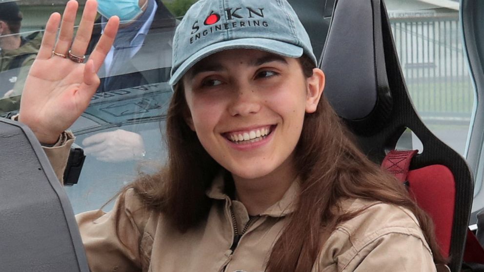 PHOTO: Belgian-British pilot Zara Rutherford, poses for pictures before departing for a round-the-world trip in a light aircraft, aiming to become the youngest female pilot to circle the planet alone, in Wevelgem, Belgium, Aug. 18, 2021. 