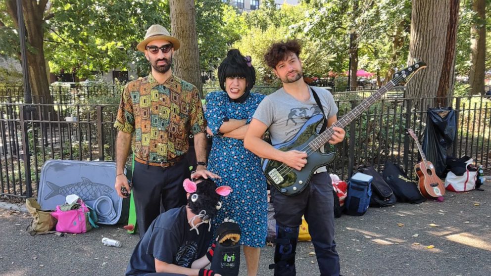PHOTO: The Pinc Louds are comprised of Claudi Love, center, a singer and guitarist, alongside Raimundo Atal, left, on keyboard and Mark Mosterin, right on bass guitar. Jamie Emerson, bottom, a visual artist, performs alongside dressed as a rat.