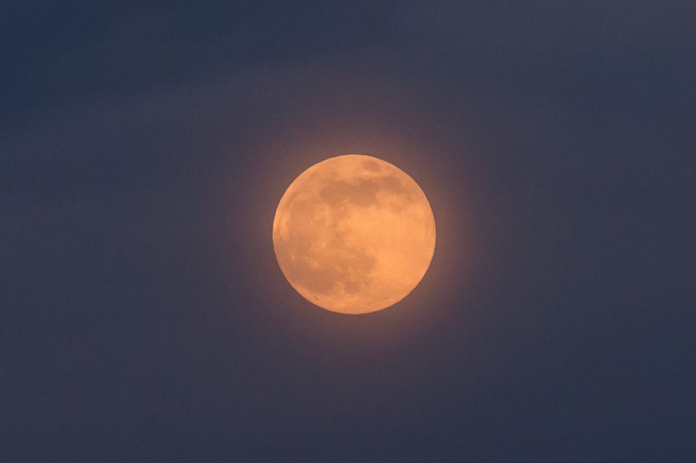 PHOTO: A near full pink moon rises above central London, April 26, 2021.