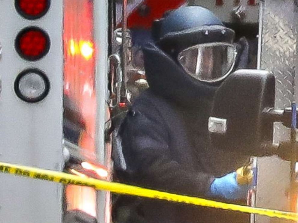 PHOTO: A bomb disposal technician carries a package out of a U.S. Post Office facility at 52nd Street and 8th Avenue in Manhattan, Oct. 26, 2018 in New York City.