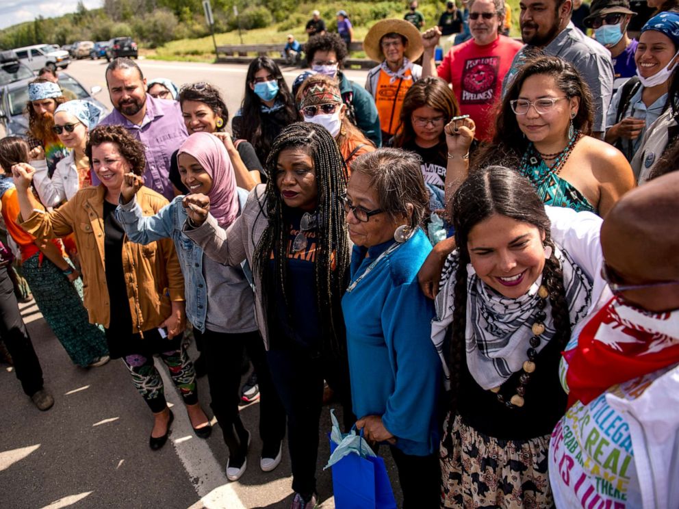 PHOTO: PARK RAPIDS, MN - SEPTEMBER 04: Rep. Cori Bush (D-MO), Rep. Ilhan Omar (D-MN), Rep. Ayanna Pressley (D-MA), State Sen. Mary Kunesh (D-MN), and Rep. Rashida Tlaib (D-MI) pose for a photo near the headwaters of the Mississippi River.