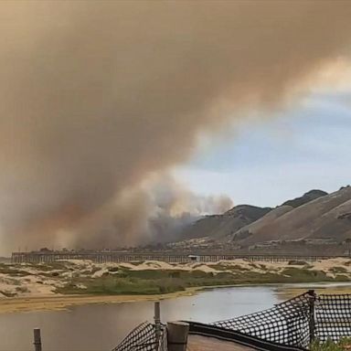 Time-lapse footage captures smoke from wildfire billowing over Pismo Beach, California.