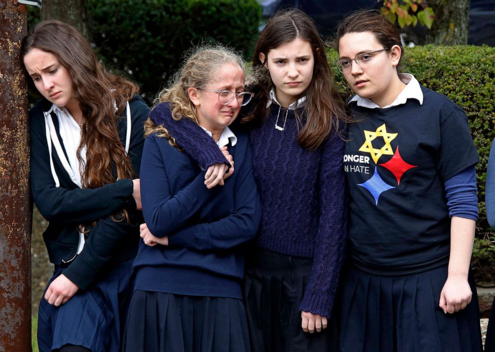 PHOTO: Students from the Yeshiva School in the Squirrel Hill neighborhood of Pittsburgh, pay their respects following a funeral service at the Jewish Community Center, Oct. 30, 2018.