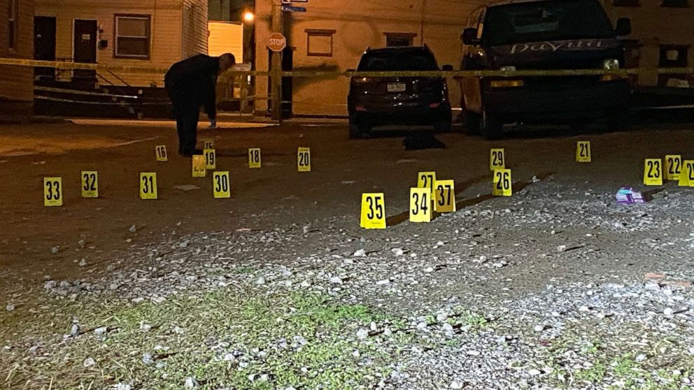 PHOTO: Investigators mark the scene of shooting in Pittsburgh, in the early hours of April 17, 2022.