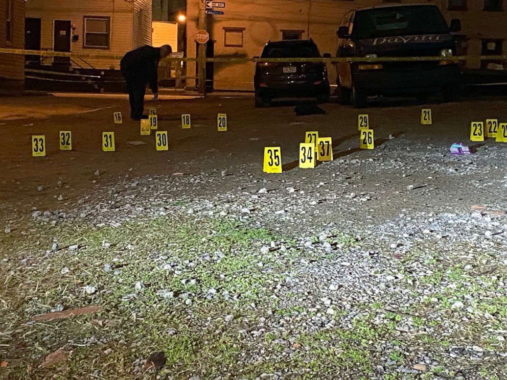 PHOTO: Investigators mark the scene of shooting in Pittsburgh, in the early hours of April 17, 2022.