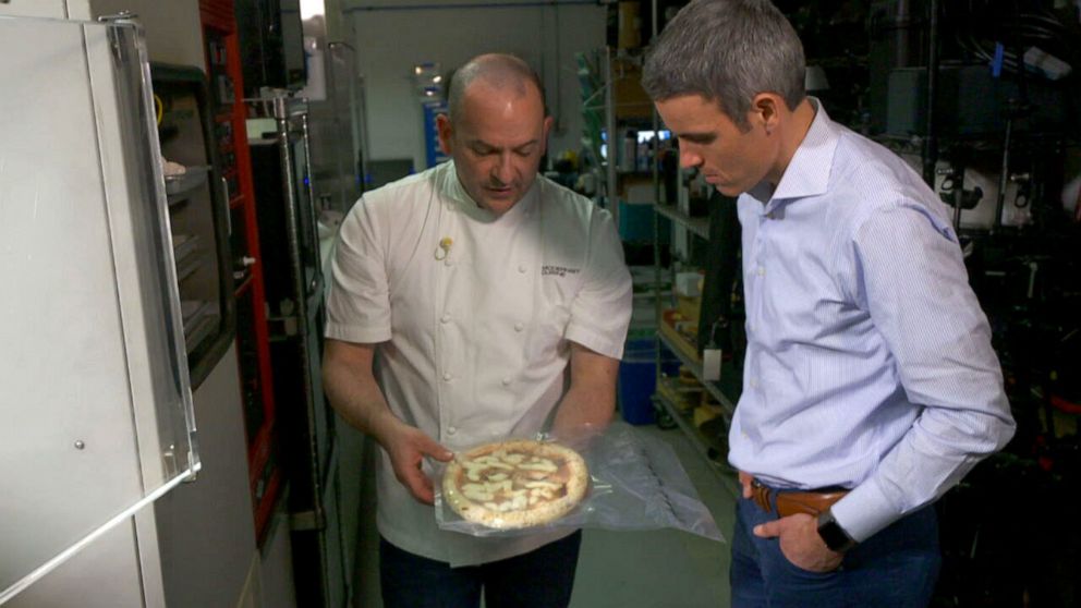 PHOTO: Chef Francisco Migoya holds a freeze-dried Neapolitan pizza that will be pulverized into a powder that can be mixed into pizza dough to intensify flavor.