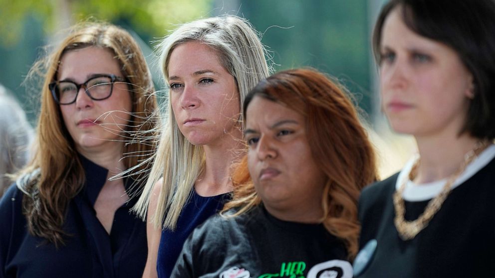 PHOTO: Amanda Zurawski, second from left, and Samantha Casiano, second from right, stand with other plaintiffs and their attorneys outside the Travis County Courthouse, July 19, 2023, in Austin, Texas.