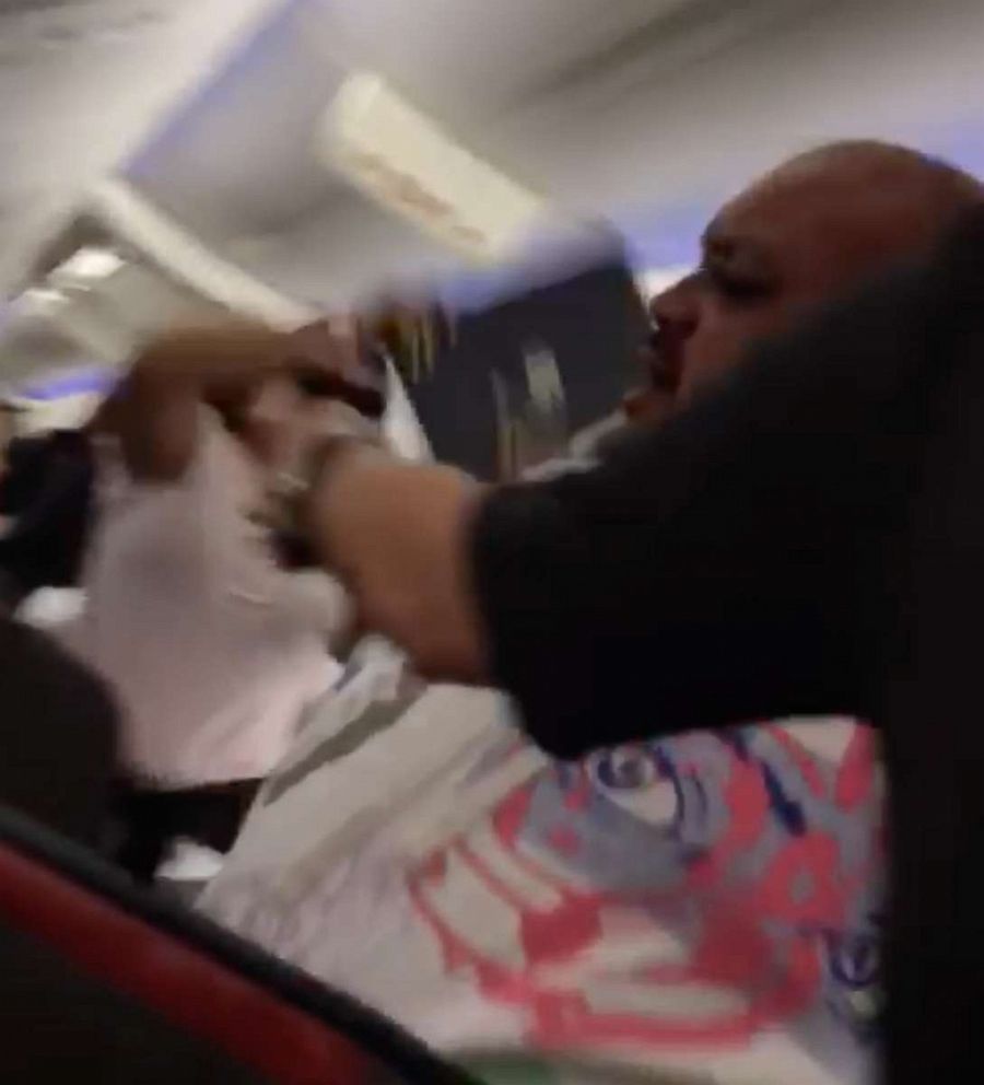PHOTO: Video shot by a passenger shows the woman, identified by police as Tiffany McLemore, striking her husband with the laptop after an expletive-filled argument between the couple.