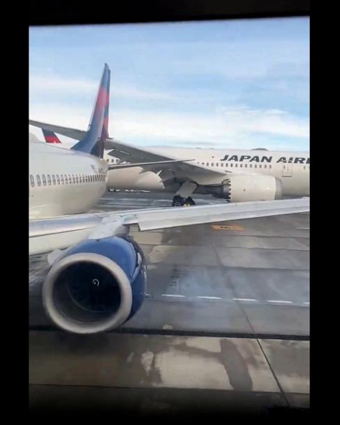 Japan Airlines flight hits tail of parked Delta plane at Seattle