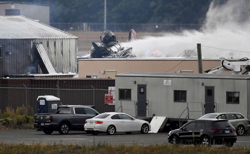 PHOTO: A fire-and-rescue operation is underway where World War II-era bomber plane crashed at Bradley International Airport in Windsor Locks, Conn., Wednesday, Oct. 2, 2019.