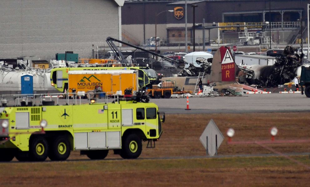 PHOTO: Emergency crews respond to where a World War II-era bomber B-17 plane crashed at Bradley International Airport in Windsor Locks, Conn., Oct. 2, 2019.