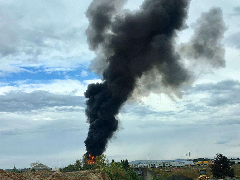 PHOTO: In this photo provided by Antonio Arreguin, smoke fills the sky after a World War II-era bomber plane crashed, Oct. 2, 2019 outside Bradley International Airport north of Hartford, Conn.
