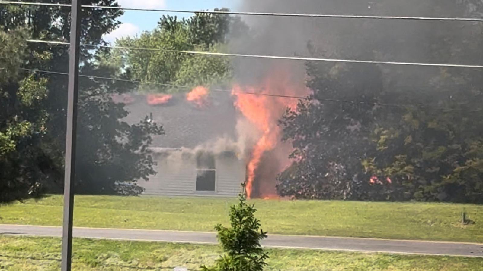 PHOTO: Two people aboard a small plane are dead after the aircraft crashed into a house in Akron, Ohio, causing a fire, authorities said.