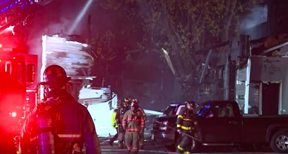PHOTO: First responders work at the scene where a small plane crashed into a multifamily building in the evening of Oct. 21, 2022 in Keene, N.H.