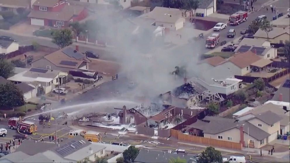 PHOTO: In this screen grab from a video, a fire truck tries to put out the fire after a small plane crashed into a home in Santee, Calif., Oct. 11, 2021.