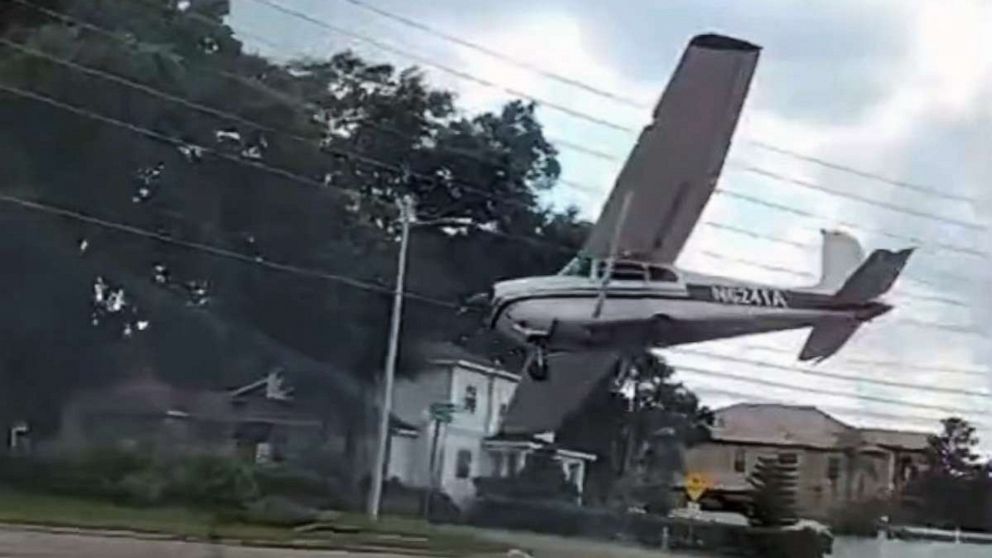 PHOTO: A bystander captured a small plane making an emergency landing on a roadway in Orlando, Fla., Aug. 19, 2022.