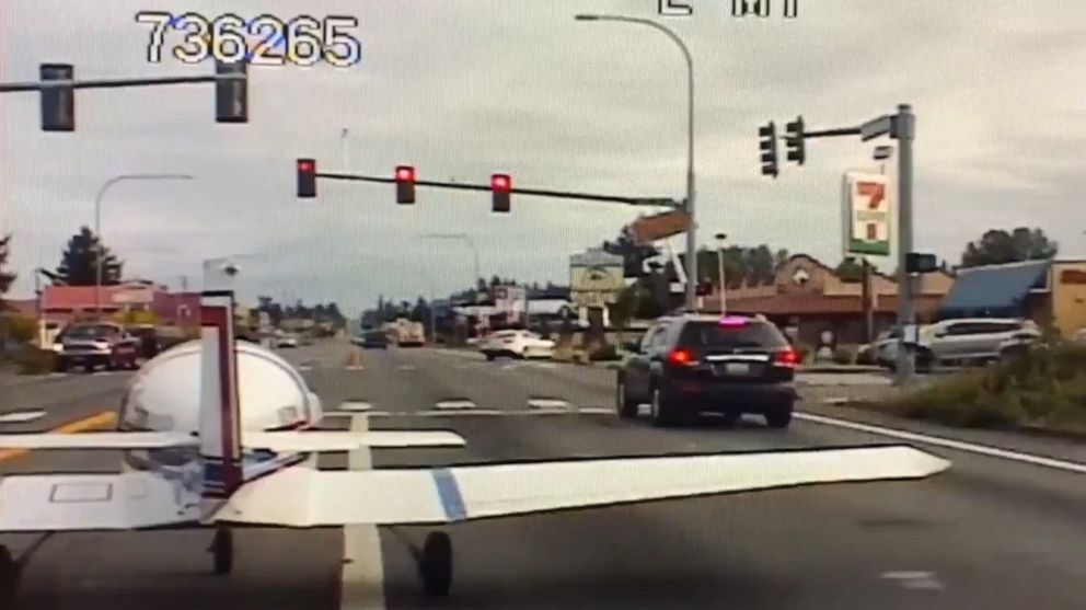 PHOTO: An image made from dash cam video released by Washington State Patrol shows a single engine plane making an emergency landing on a road in East Pierce County, Wash., Aug. 1, 2019.