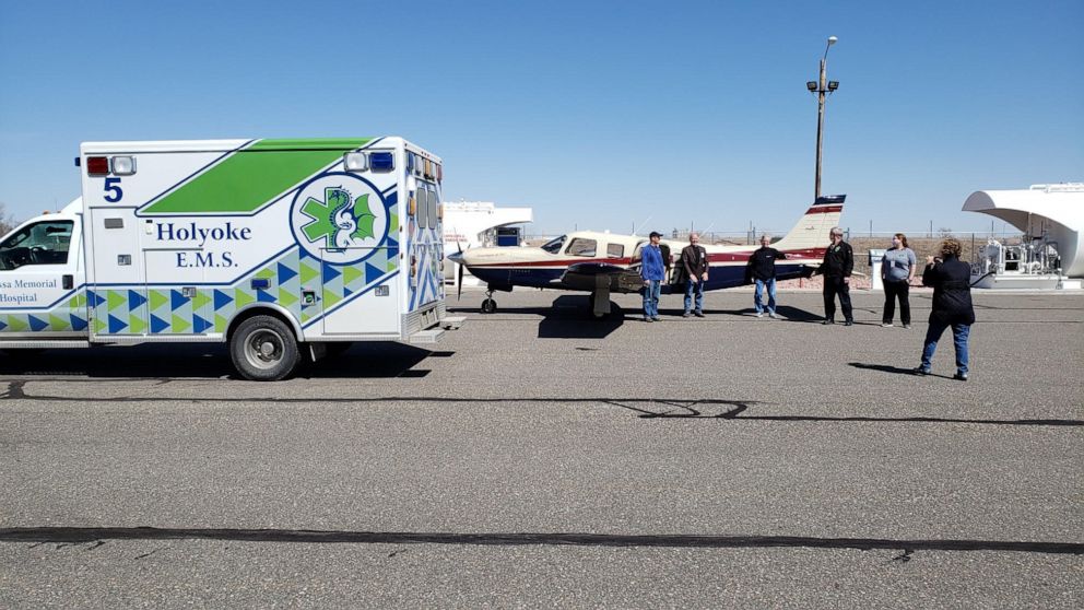 PHOTO: Volunteer pilot Erick Ecklund of Denver, Colo., delivers eight boxes of homemade personal protective equipment to staff from the Melissa Memorial Hospital in rural Holyoke, Colo.