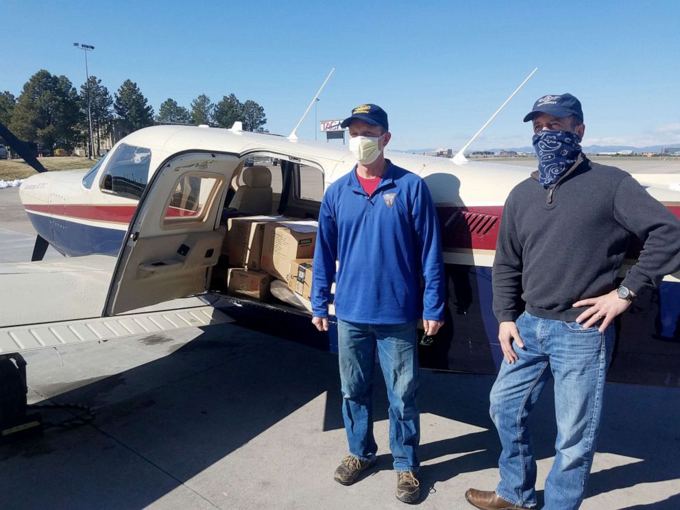 PHOTO: Pilot Erick Ecklund, left, volunteers his time during a leave of absence from United Airlines to deliver masks and face shields produced by the Make4Covid grassroots network to help respond to COVID-19.