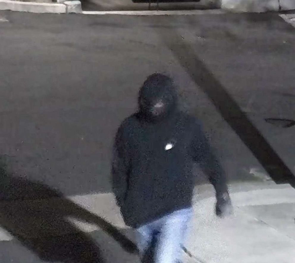 PHOTO: In this image released by the FBI, a person is shown who is a suspect in the throwing of a the Molotov cocktail at a building used by Planned Parenthood, in Costa Mesa, Calif., on March 13, 2022.