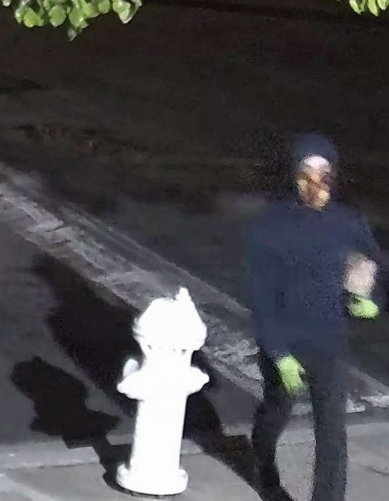 Photo: In this image released by the FBI, a suspect allegedly throws a Molotov cocktail at a building used by Planned Parenthood in Costa Mesa, California, on March 13, 2022.