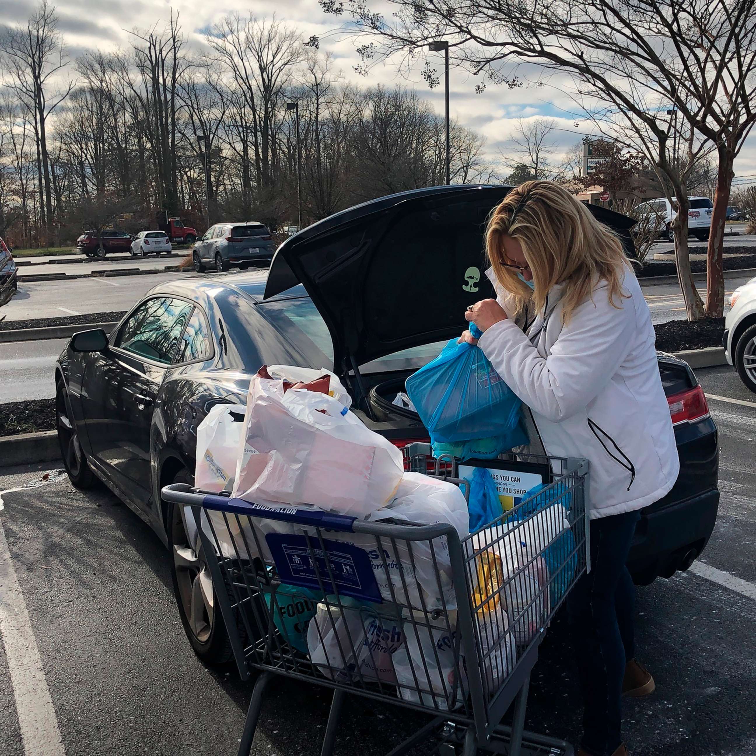 PHOTO: Donna Volger of Dover, Del. loads up her groceries after a shopping trip on Dec. 17, 2020.