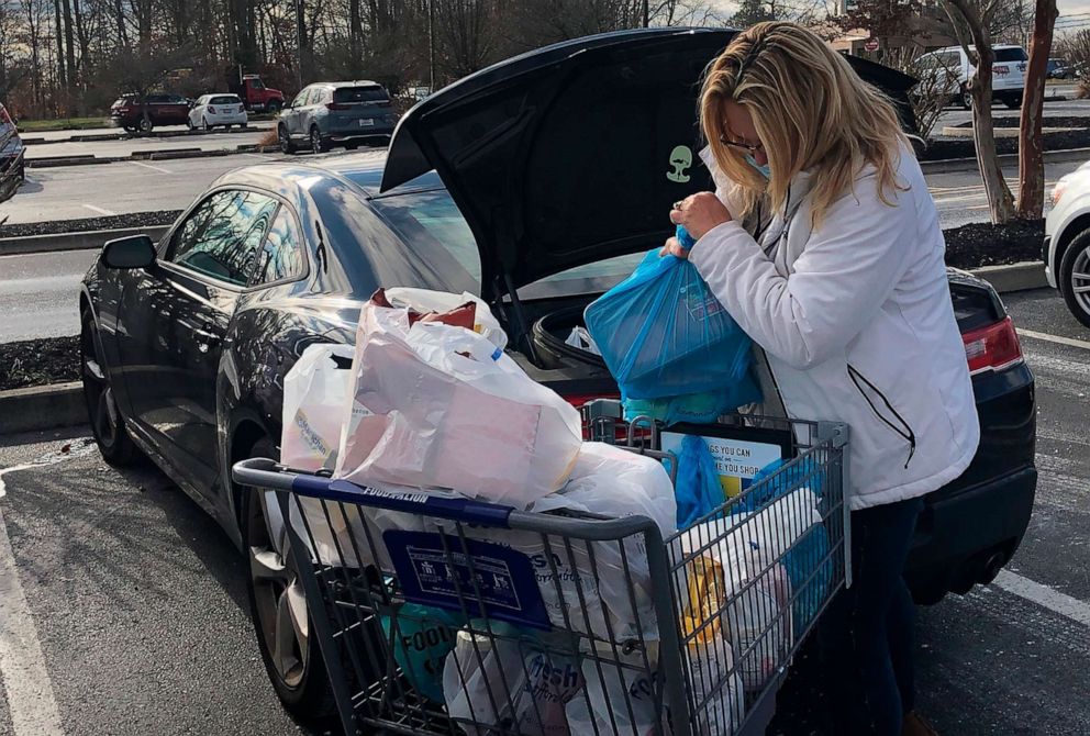PHOTO: Donna Volger of Dover, Del. loads up her groceries after a shopping trip on Dec. 17, 2020.
