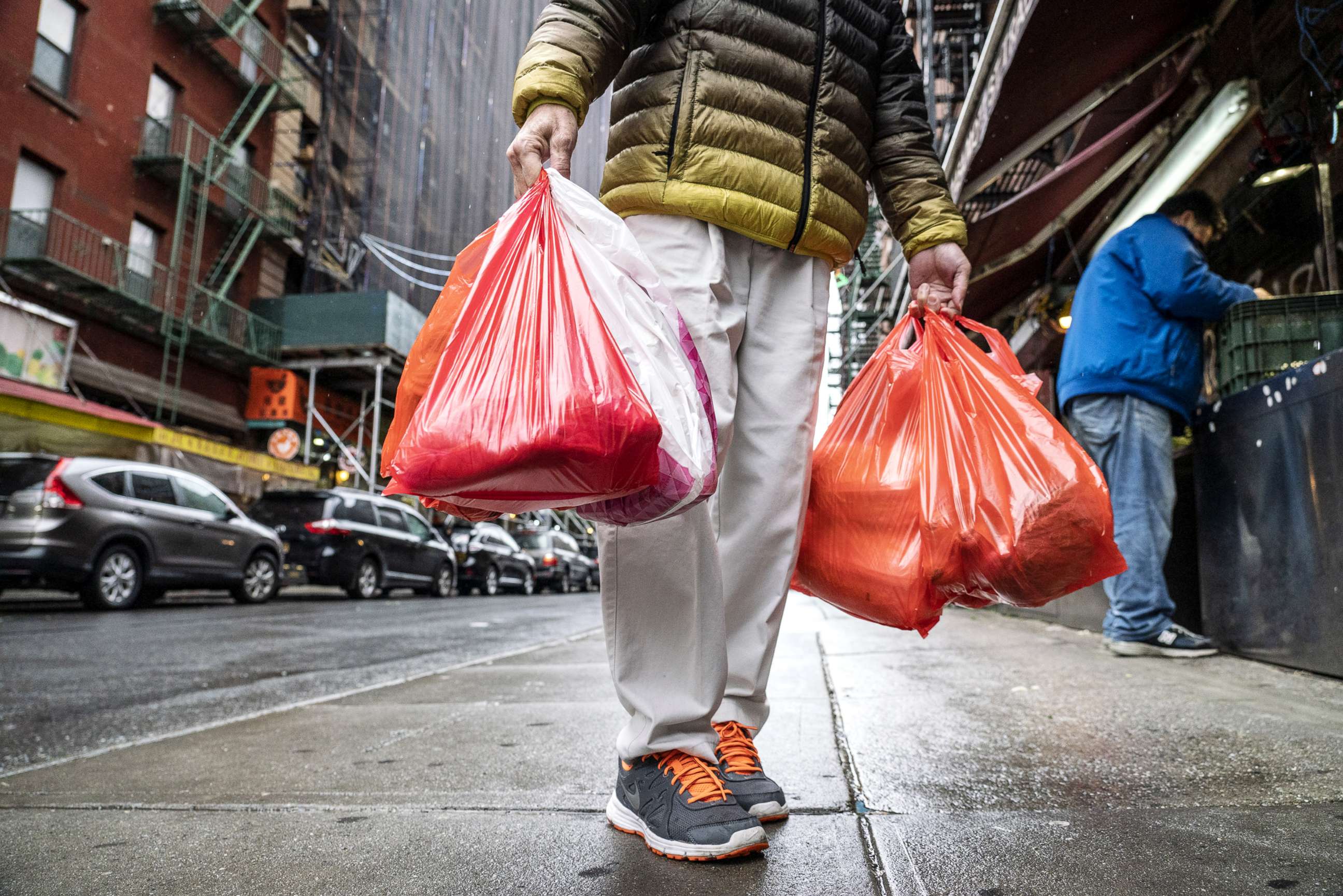 PHOTO: A pedestrian carries plastic shopping bags in New York, March 31, 2019. 