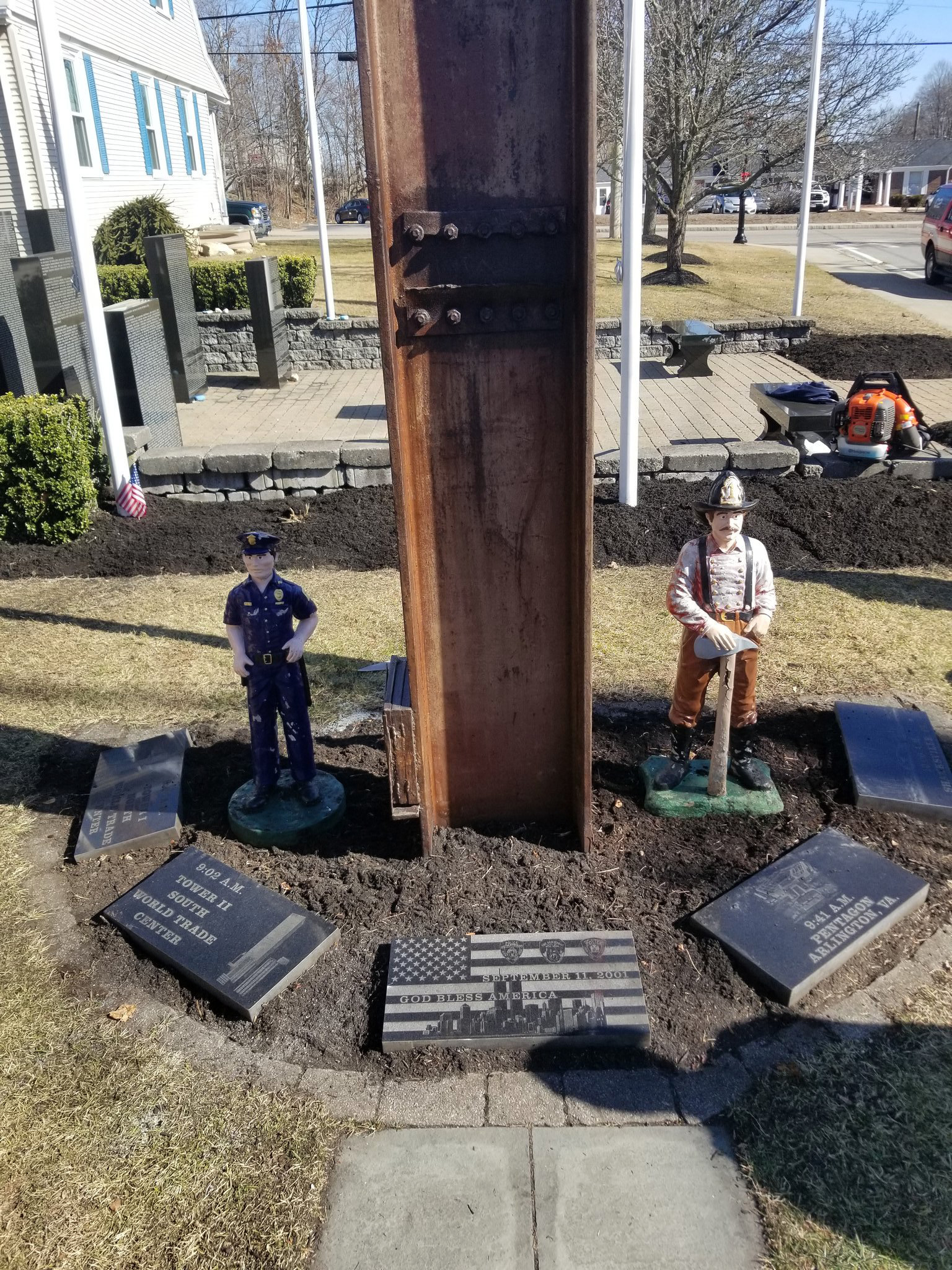 PHOTO: Firefighters repair a 9/11 memorial in Plymouth, Mass. after it was vandalized, Feb. 24, 2020.