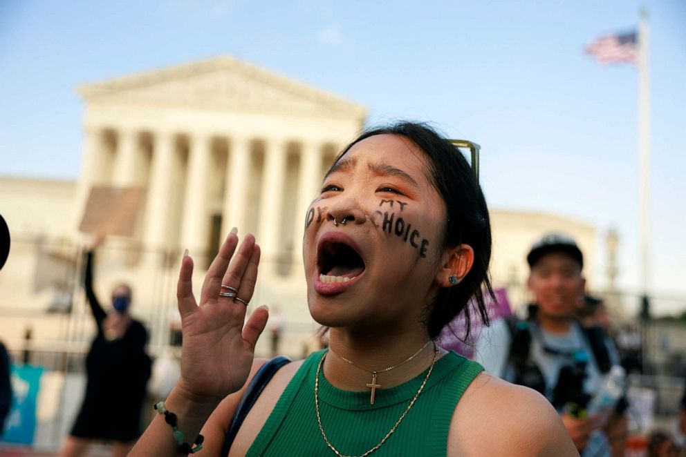 PHOTO: Robin Gwak protests outside the Supreme Court of the United States after a conservative majority struck down Roe v Wade in Washington, June 25, 2022.