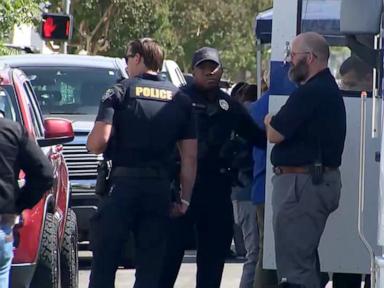 Standoff underway after bomb threat reported at bank: Police
