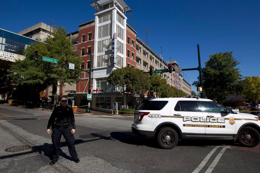 PHOTO: Montgomery police officer block the intersection outside of a parking garage where a police officer was shot, in Silver Spring, Md., Oct. 14, 2019.  