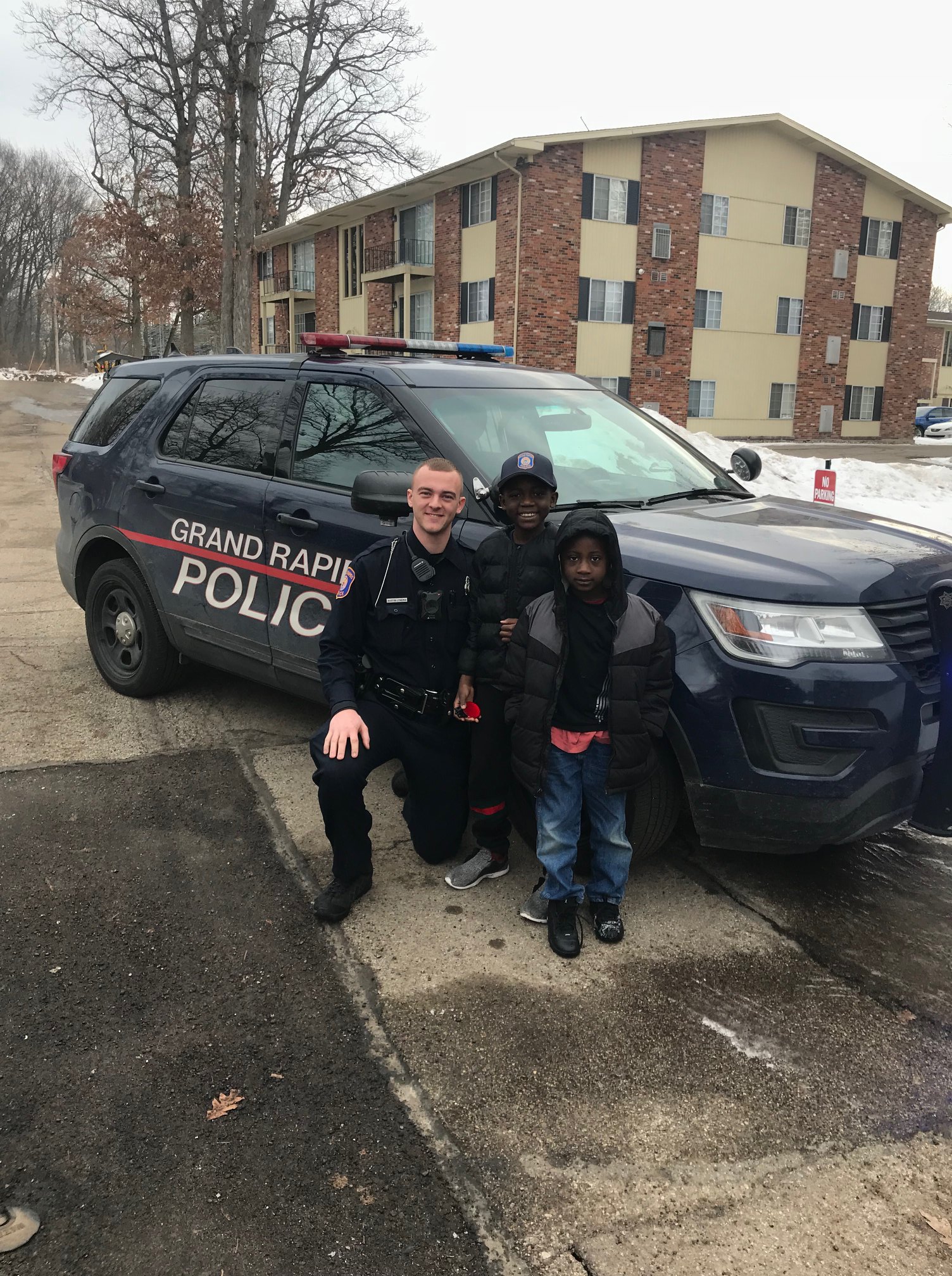 Officers from the Grand Rapids Police Department help celebrate 9-year-old Thomas Daniel's birthday. 