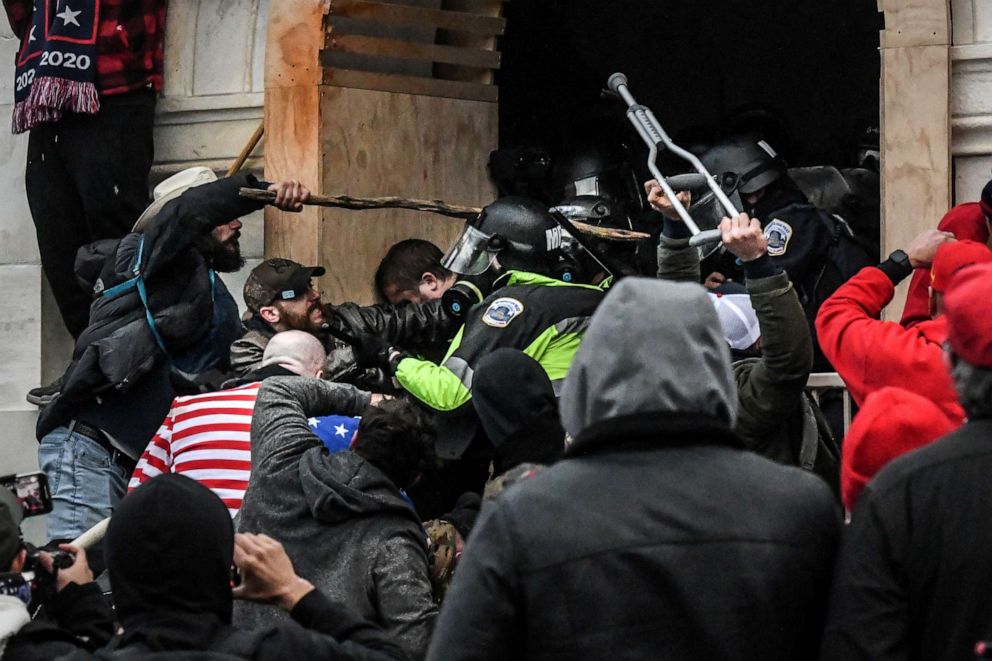 PHOTO: Supporters of U.S. President Donald Trump battle with police at the west entrance of the U.S. Capitol building during a riot in Washington, D.C., on Jan. 6, 2021.
