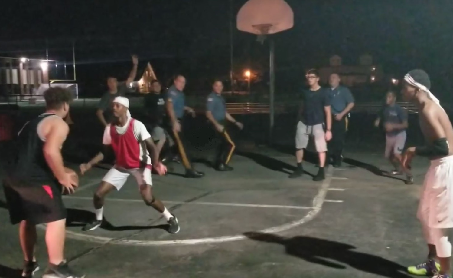 PHOTO: Pompton Lakes (NJ) police officers join in a pick-up basketball game between local youths, Sept. 23, 2019. 