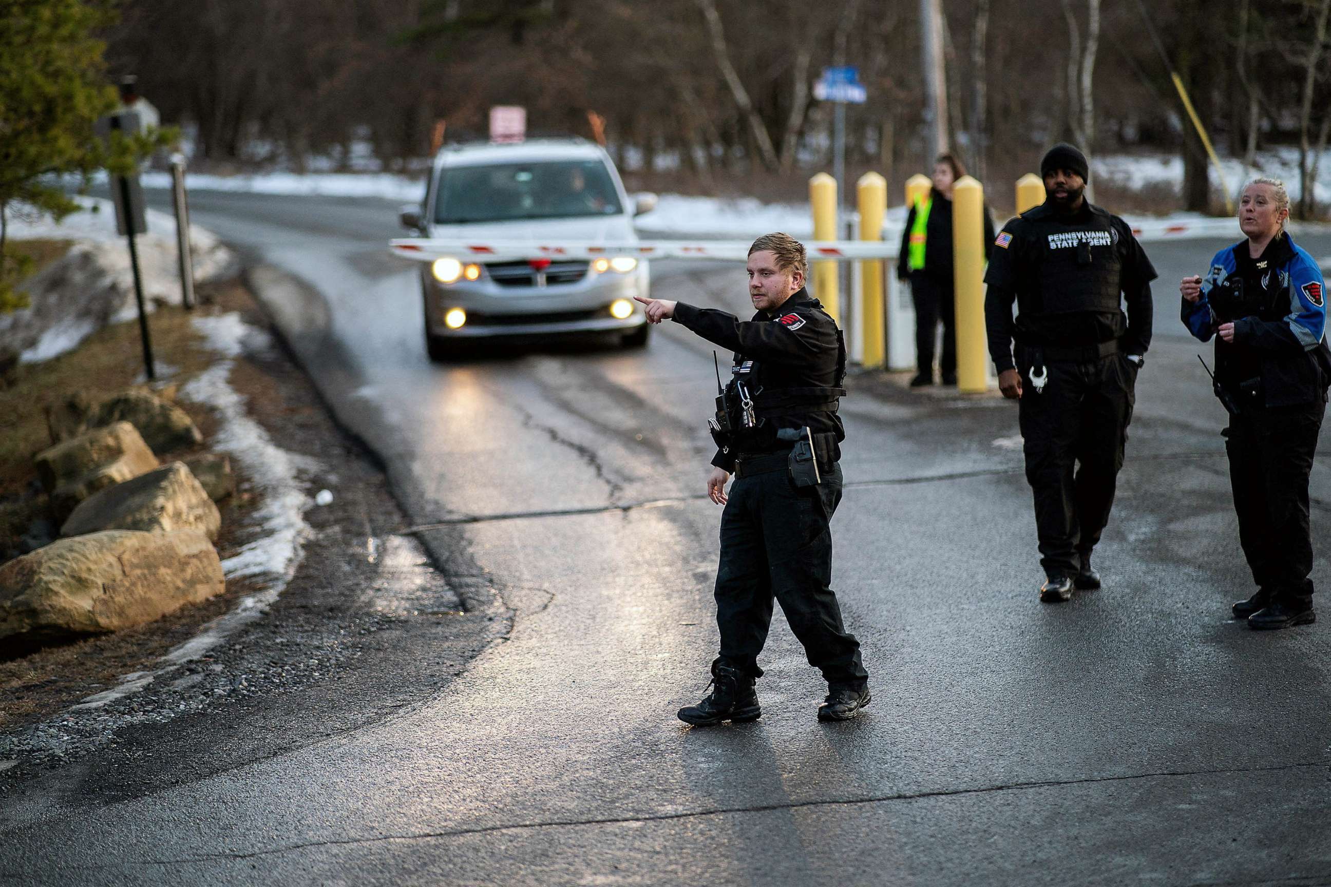 PHOTO: FILE - Security workers and Pennsylvania State Agents stand guard at the entrance of the Indian Mountain Lake private in Albrightsville, PA, Dec. 30, 2022.