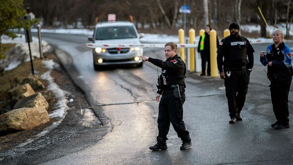 PHOTO: FILE - Security workers and Pennsylvania State Agents stand guard at the entrance of the Indian Mountain Lake private in Albrightsville, PA, Dec. 30, 2022.