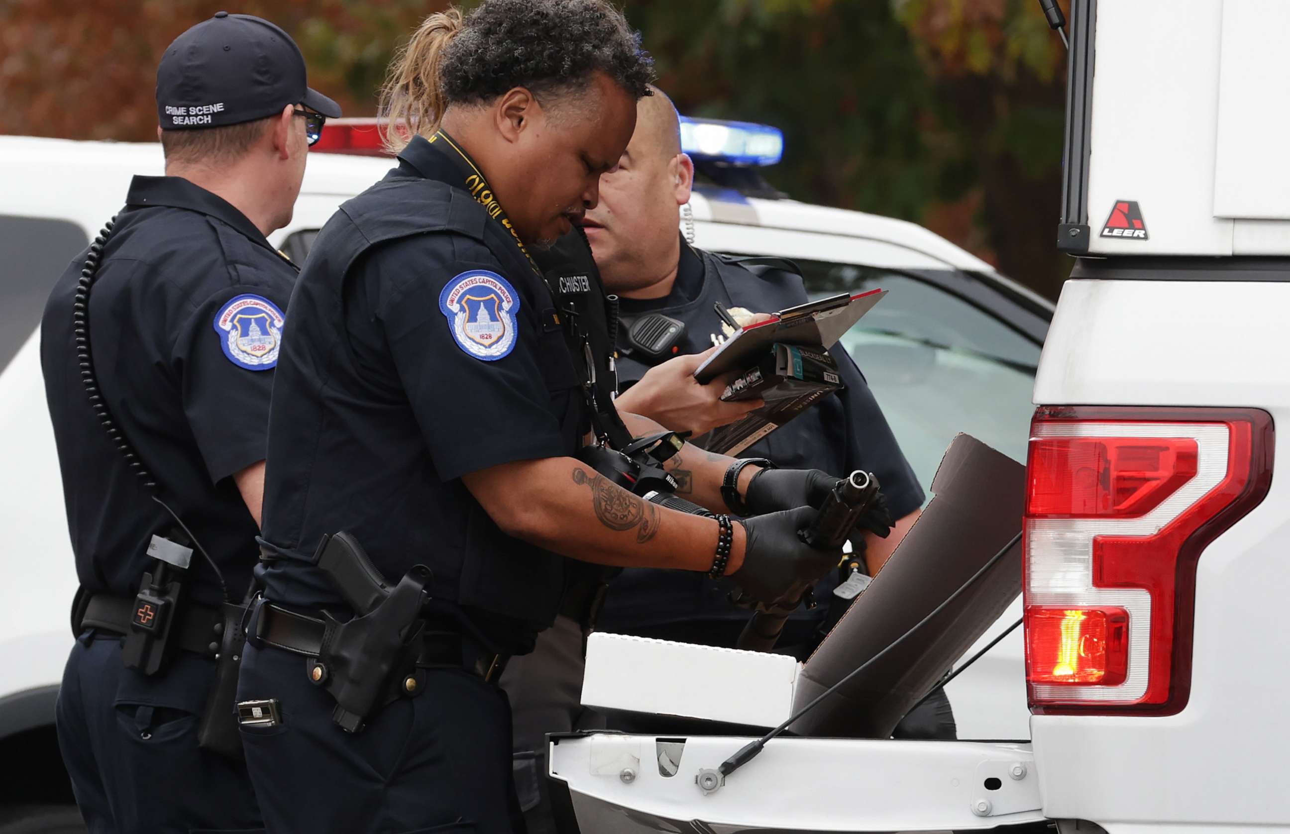 PHOTO: U.S. Capitol Police search a vehicle after arresting an unidentified individual who was in possession of a firearm outside of the U.S. Capitol Building on Nov. 7, 2023, in Washington, D.C.