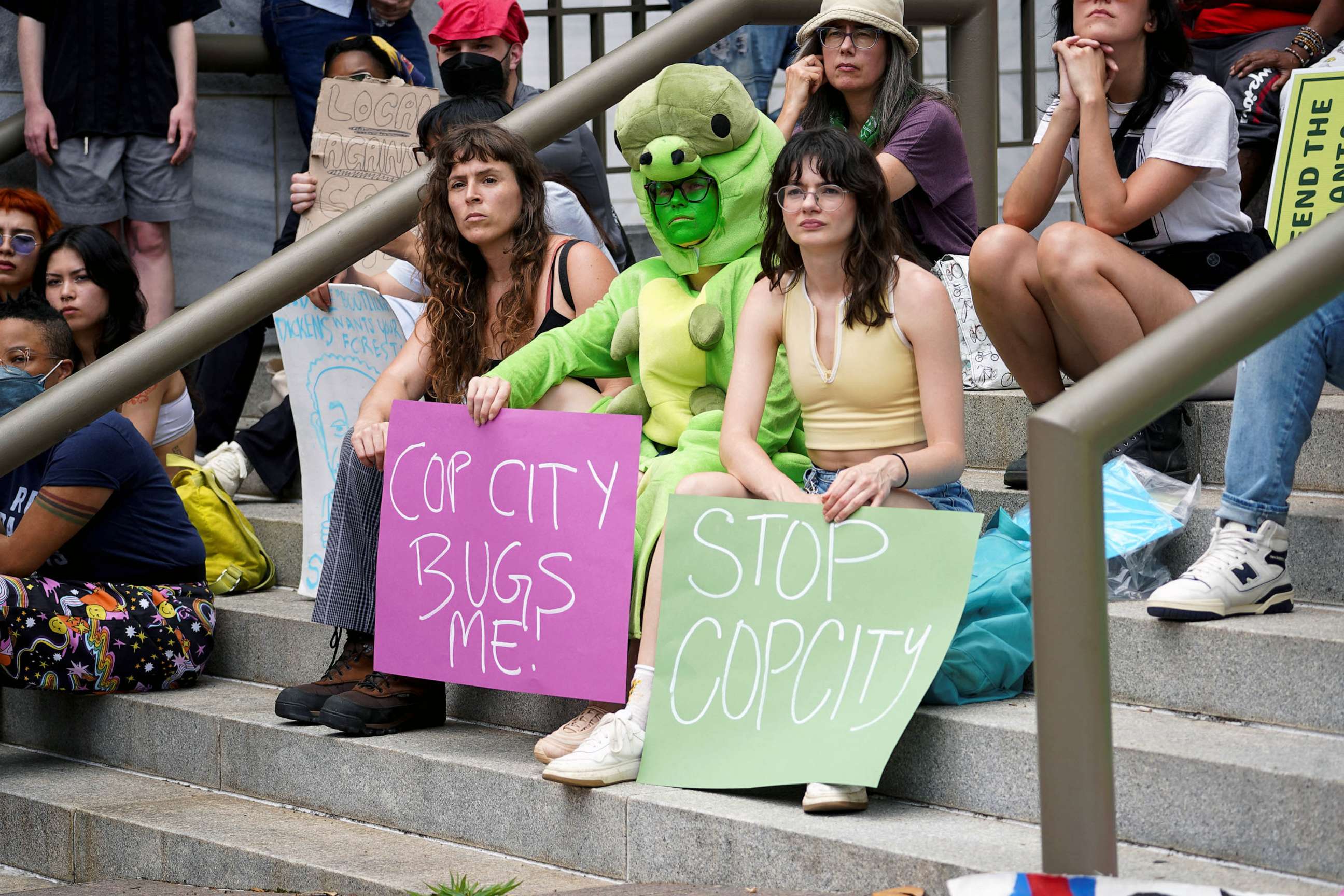 PHOTO: People protest against the controversial "Cop City" project, outside the city hall in Atlanta, May 15, 2023.