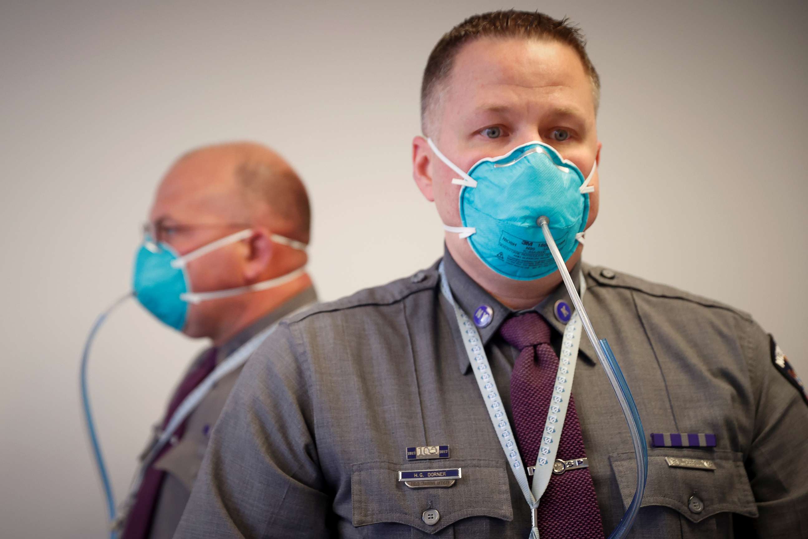 PHOTO: New York State Police Troopers are fitted for N95 protective masks at a New York State emergency operations incident command center during the coronavirus outbreak in New Rochelle, N.Y.,  March 17, 2020.