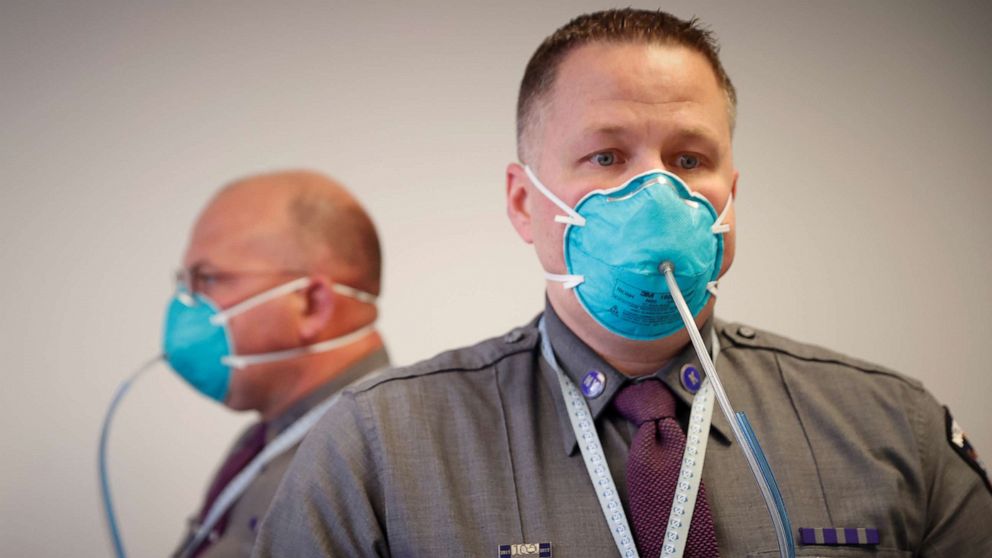 PHOTO: New York State Police Troopers are fitted for N95 protective masks at a New York State emergency operations incident command center during the coronavirus outbreak in New Rochelle, N.Y., March 17, 2020.