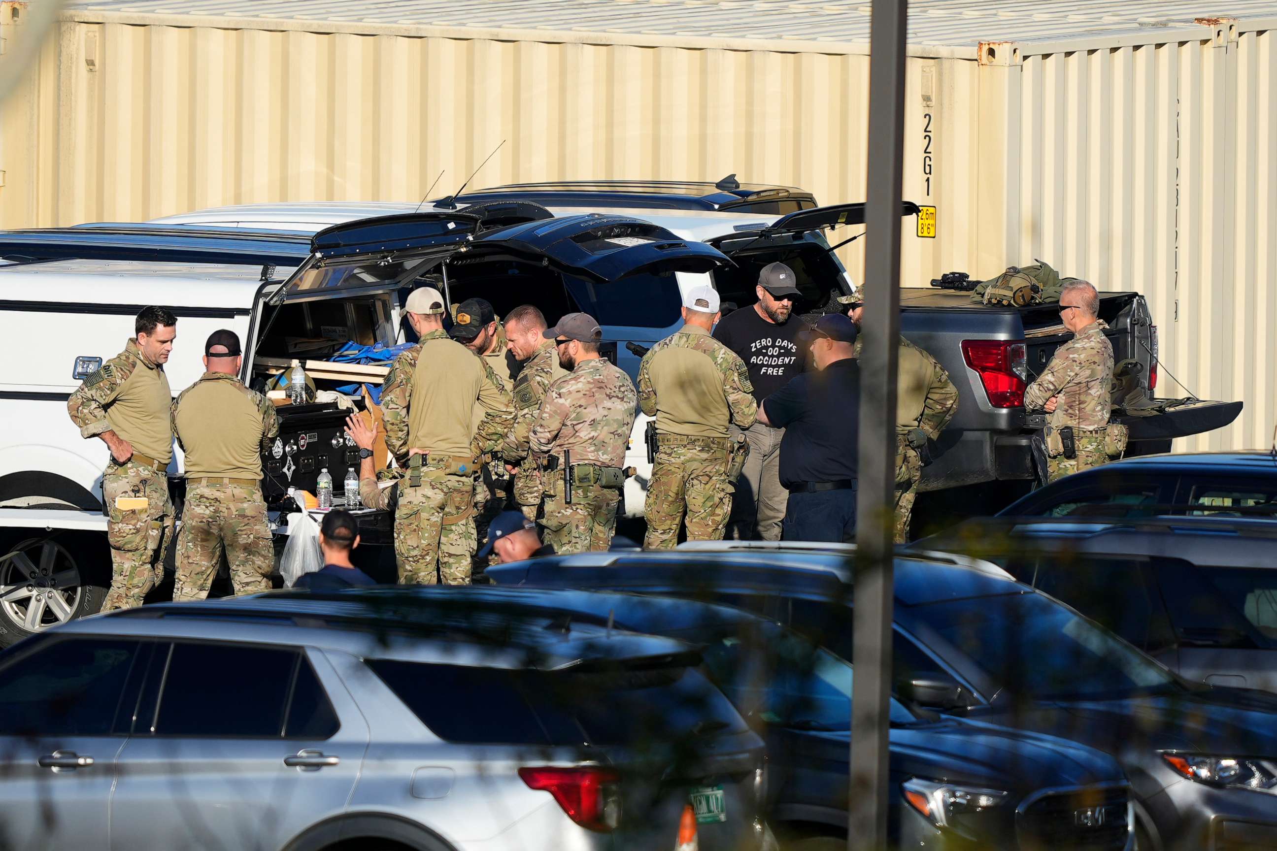 PHOTO: Law enforcement officers are staged in a school parking lot as a manhunt continues in the aftermath of a mass shooting in Lewiston, Maine, Friday, Oct. 27, 2023.