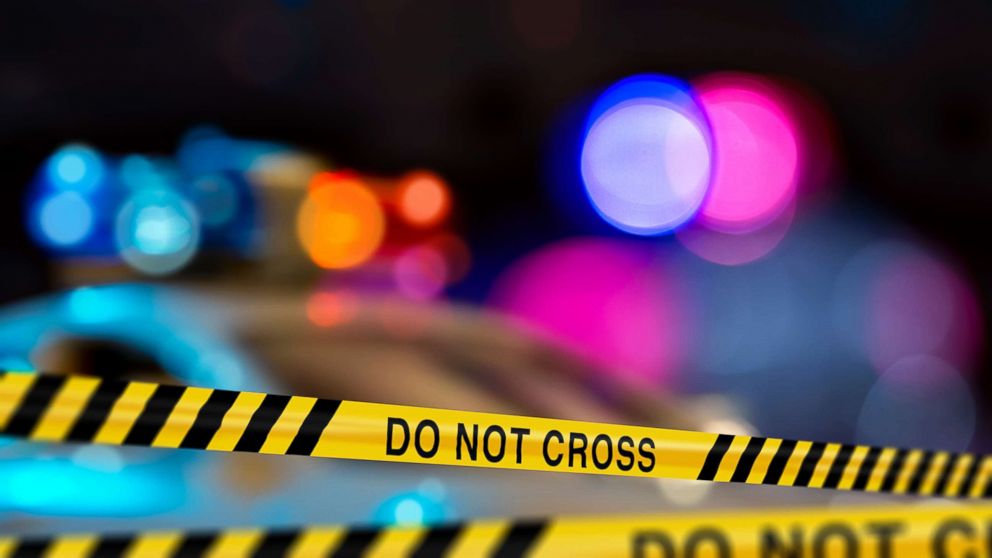 Police crime scene tape on a city street is pictured in this undated stock photo.