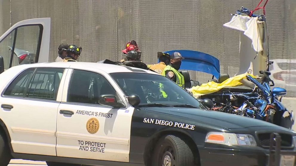 PHOTO: Police officers stand at the site of a fatal wrong-way crash that killed three people in San Diego on June 4, 2021.