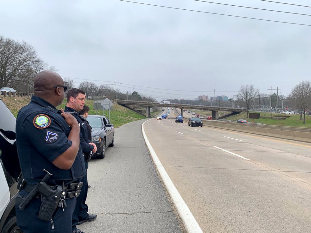 PHOTO: Officers lined up to greet Louie Schneider as he was driven to Arkansas Children's Hospital, Feb. 28, 2019, in Little Rock, Arkansas.