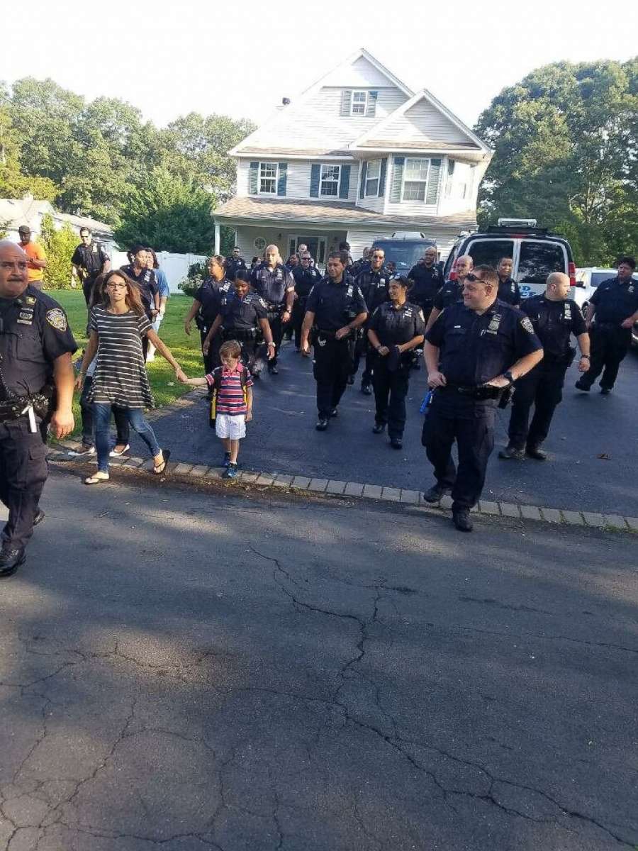 PHOTO: Officers greeted Austin Tuozzolo, the young son of fallen NYPD Sgt. Paul Tuozzolo, at his home in Suffolk County to send him off to his first day of school.