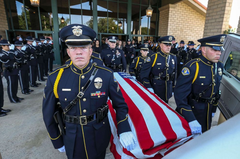 PHOTO: Police officers stand as the funeral procession of slain Whittier police officer Keith Boyer leaves the Calvary Chapel, March 3, 2017 in Downey, Calif. Officer Boyer was shot on killed Feb. 20, 2017, while responding to a traffic accident.