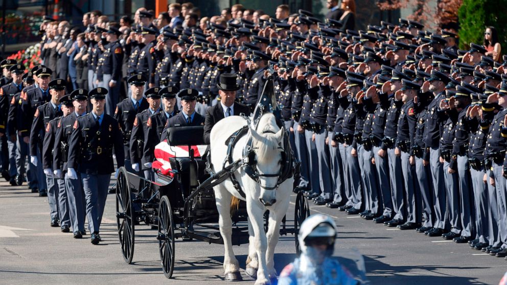 PHOTO: A funeral caisson transports the casket of Raleigh Police Officer Gabriel Torres to Cross Assembly Church in Raleigh, N.C. for his funeral, Oct. 22, 2022.